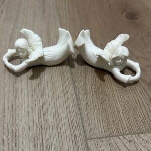 Vintage white ceramic angel cherub
napkin rings or candle climbers.